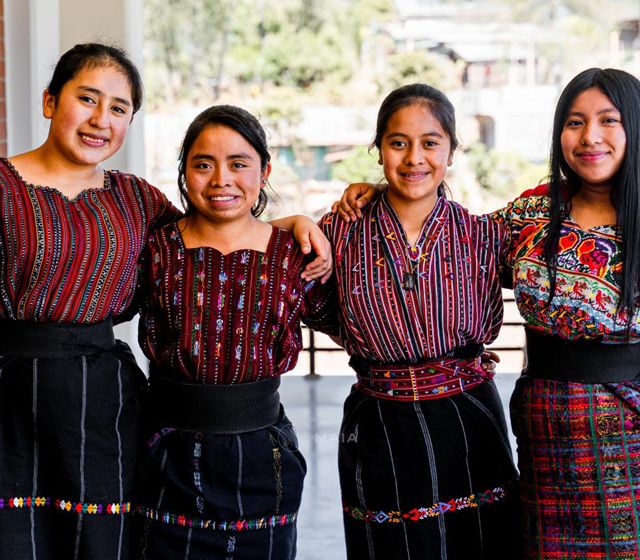 Women in BOLT program looking at chart on wall