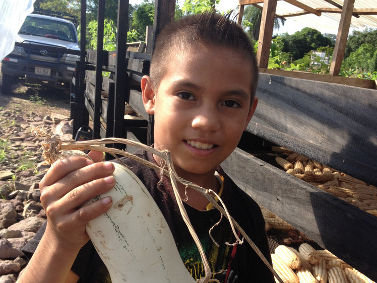 Alejandro holding a gourd at Self Help International.