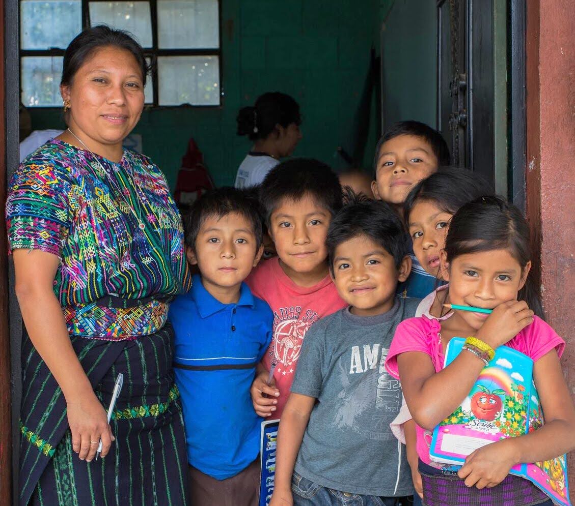 Woman with children from Child Aid