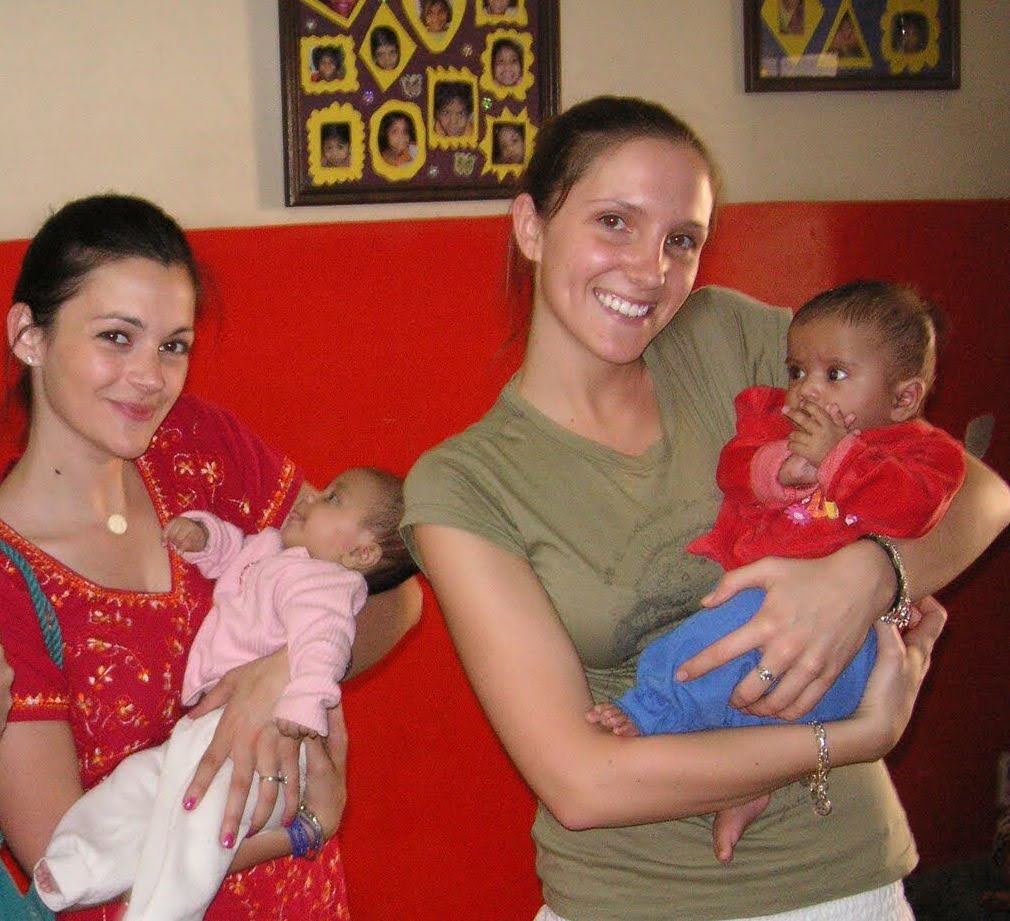 Two women holding infants at Hope Worldwide