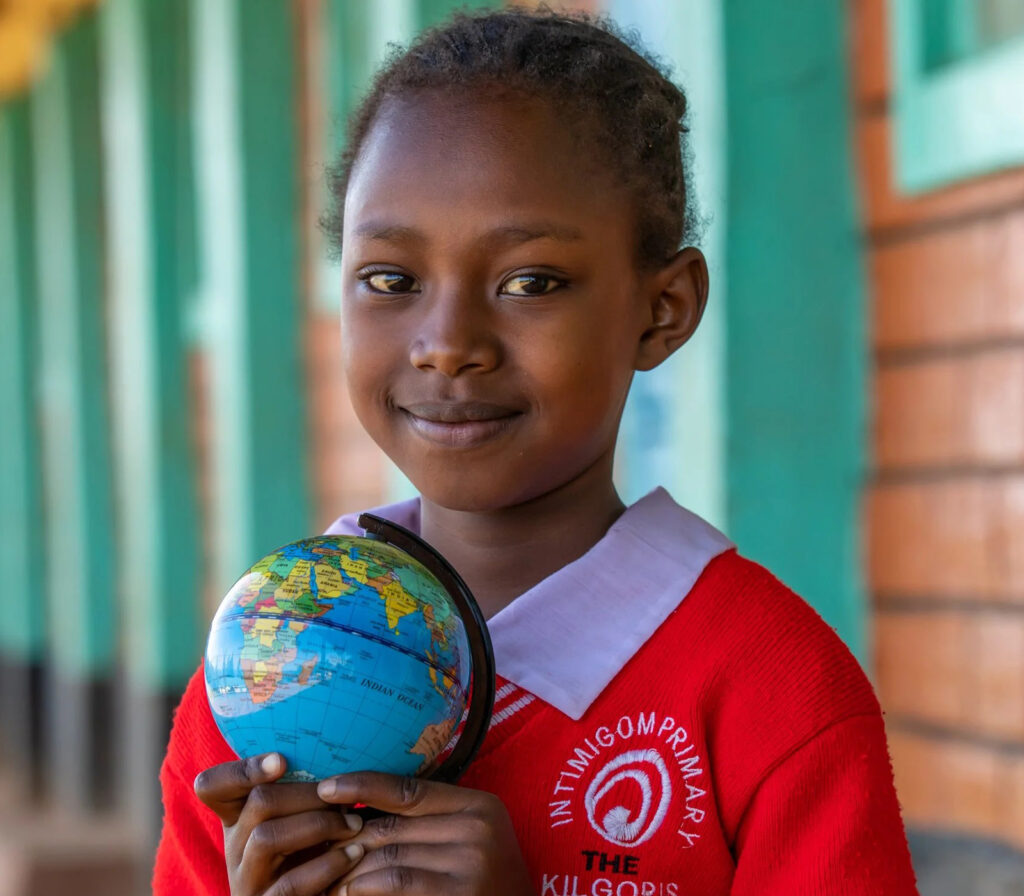 Current Grantees 12 Girl in uniform holding globe
