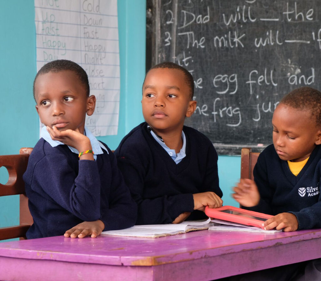 Current Grantees 19 Three boys sitting in class